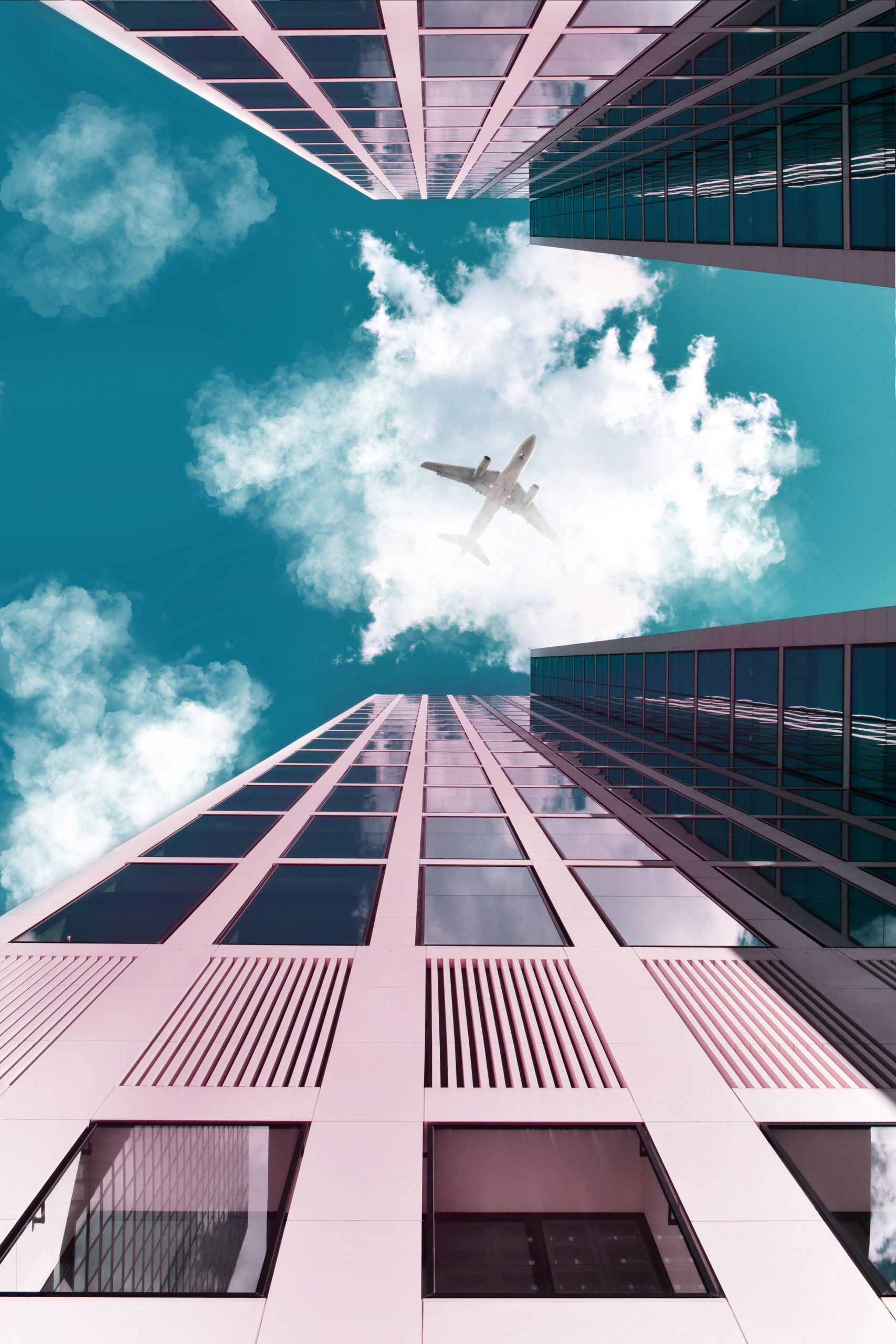 Photograph of an airplane flying over buildings in Miami